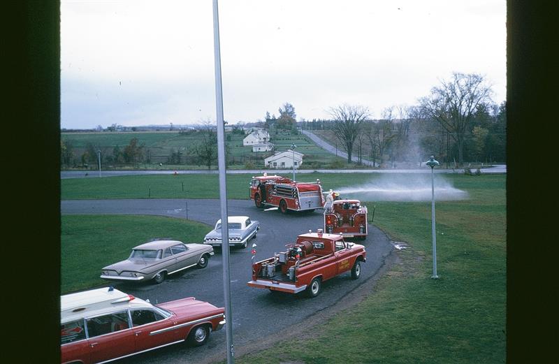 Old fire trucks from Rush Fire Department in the parking loop at Leary